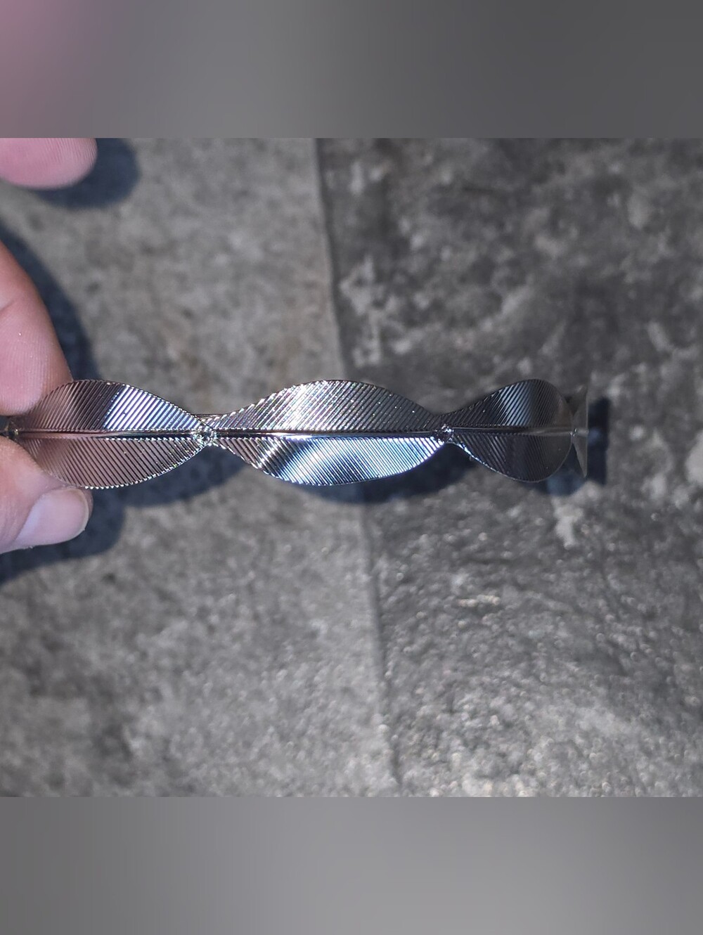 Silver-colored Metallic Headband Adorned with Repeating Textured Leaf Patterns